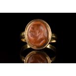 RARE ROMAN CARNELIAN INTAGLIO WITH A FLAVIAN PORTRAIT IN GOLD RING