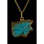 EGYPTIAN FAIENCE WEDJAT-EYE AMULET IN LATER GOLD PENDANT