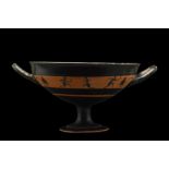 ATTIC BLACK-FIGURE BAND KYLIX WITH ATHLETES