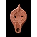 ROMAN TERRACOTTA OIL LAMP WITH A DANCER