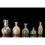 COLLECTION OF FIVE ROMAN GLASS FLASKS