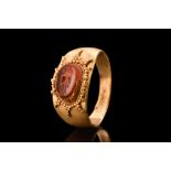 ROMAN CARNELIAN JANUS INTAGLIO IN GOLD RING