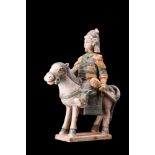 CHINESE MING DYNASTY GLAZED TERRACOTTA RIDER ON A HORSE