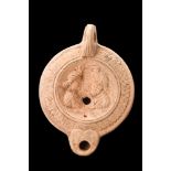 EASTERN ROMAN BEIGE TERRACOTTA OIL LAMP WITH ISIS AND SERAPIS BUSTS