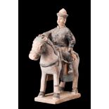 CHINESE MING DYNASTY GLAZED TERRACOTTA RIDER ON A HORSE