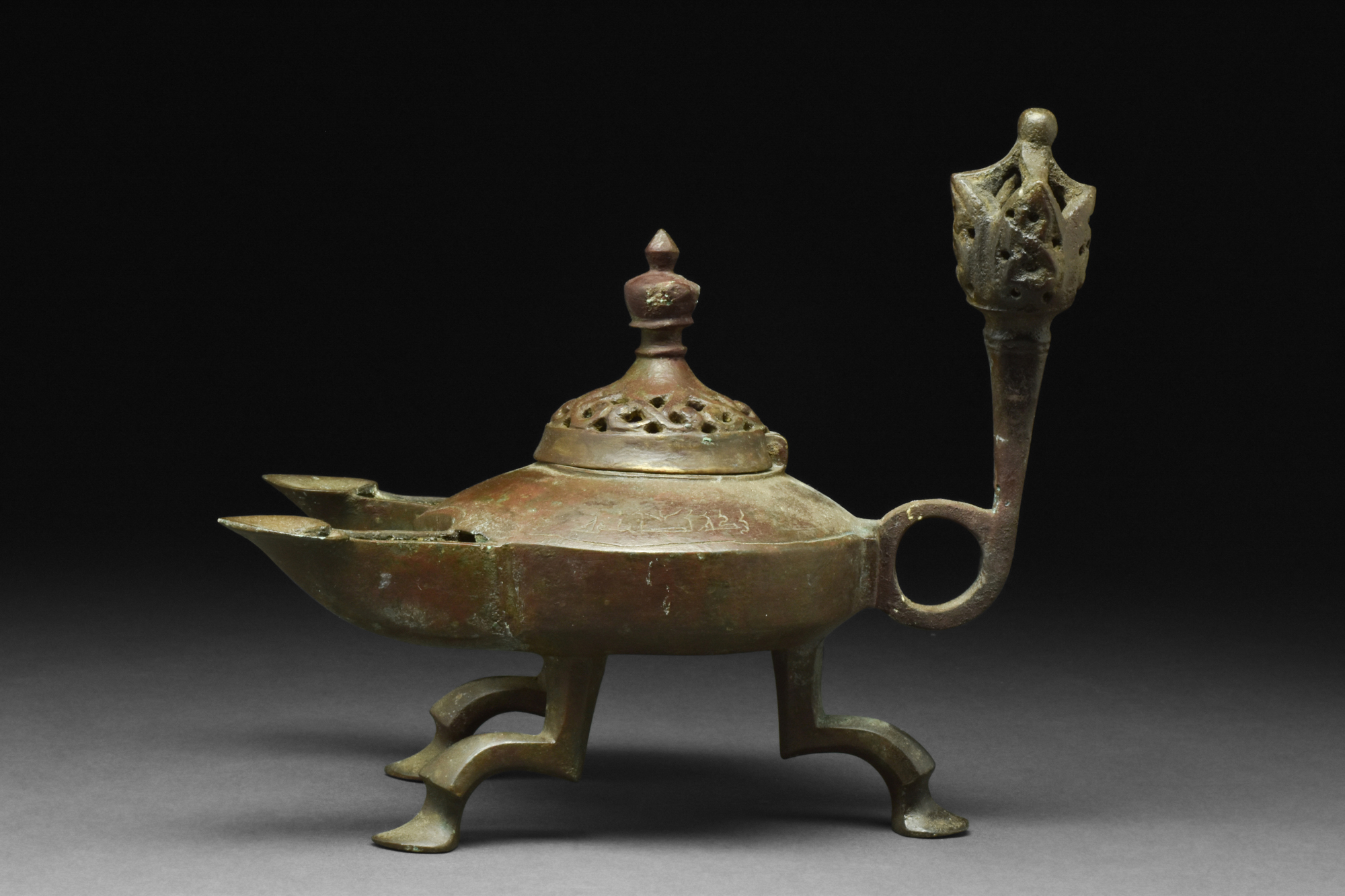 SELJUK BRONZE TRIPOD OIL LAMP WITH TWO SPOUTS