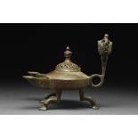 SELJUK BRONZE TRIPOD OIL LAMP WITH TWO SPOUTS