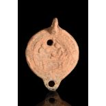 ROMAN TERRACOTTA OIL LAMP WITH EROTIC SCENE