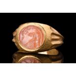 ROMAN INTAGLIO WITH MOURNING SCENE, POSSIBLY ARISTOMENES IN GOLD RING