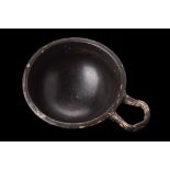 APULIAN BLACK GLAZE CUP WITH HANDLE