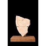ROMAN MARBLE FRAGMENT WITH FLORAL PATTERN ON STAND