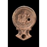 ROMAN TERRACOTTA OIL LAMP WITH EROTIC SCENE