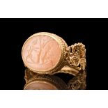 ROMAN AGATE INTAGLIO WITH BUCOLIC SCENE IN A GOLD RING