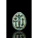 EGYPTIAN STEATITE SCARAB FLANKED BY THREE STEM PAPYRUS