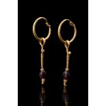 MATCHED PAIR OF ROMAN GOLD EARRINGS WITH GARNETS