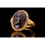 ROMAN SATYR GARNET CAMEO IN A SOLID GOLD RING