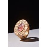 ROMAN CARNELIAN INTAGLIO WITH A HAND HOLDING EARS OF GRAIN AND POPPY SEED HEADS IN A GOLD RING