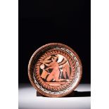 GREEK APULIAN RED-FIGURE FOOTED PLATE WITH WINGED EROS