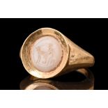 ROMAN INTAGLIO WITH A MAN MILKING A GOAT IN GOLD RING