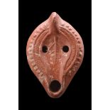 ROMAN NORTH AFRICAN TERRACOTTA OIL LAMP WITH A LEAF