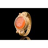 ROMAN CARNELIAN INTAGLIO WITH MERCURY RIDING A ROOSTER IN A GOLD RING