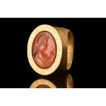 LATE HELLENISTIC JAPSER INTAGLIO OF GODDESS IN LARGE GOLD RING