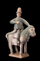 CHINESE MING DYNASTY GLAZED TERRACOTTA HORSE WITH A RIDER