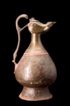 SELJUK BRONZE EWER WITH LAMP-SHAPED SPOUT