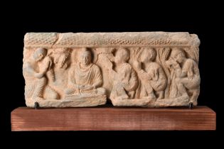 GANDHARAN SCHIST RELIEF PANEL WITH BUDDHA AND HIS WORSHIPPERS