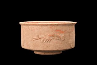 EASTERN ROMAN ORANGE TERRACOTTA CUP WITH CRUSTACEANS AND FISH DECORATION