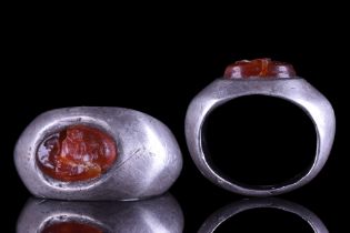 ROMAN SILVER RING WITH CARNELIAN INTAGLIO OF CUPID RIDING A HIPPOCAMPUS