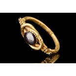 ROMANO-EGYPTIAN GOLD BRACELET WITH “HERCULES’ KNOT” SET WITH A GARNET