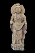 LARGE GANDHARAN SCHIST FIGURE OF BODHISATTVA MAITREYA