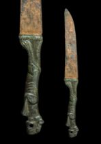 ROMAN IRON KNIFE WITH LION-SHAPED BRONZE HANDLE