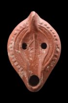 ROMAN NORTH AFRICAN TERRACOTTA OIL LAMP WITH A LEAF