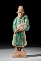 CHINESE MING DYNASTY GLAZED TERRACOTTA ATTENDANT