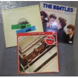 Three vinyl LPs of The Beatles to include; 1962-66 double album on red vinyl, 'The Beatles at the