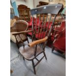 Late Victorian elm and ash stained spindle back kitchen armchair. (B.P. 21% + VAT)