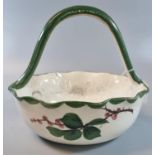 19th Century Llanelly pottery Shufflebotham wild rose fruit basket with high loop handle. 21cm