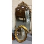 Mid century frameless arch top mirror with gilt metal mounts together with another oval gilt