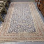 Middle Eastern design blue ground carpet having central stylised floral and foliate panels with