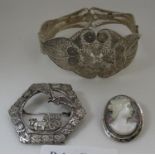 An 800 silver brooch, silver filigree bangle and a mother of pearl cameo brooch. (B.P. 21% + VAT)