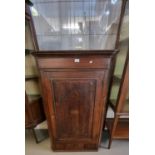 Early 19th century oak single drawer blind panelled hanging corner cupboard, the interior