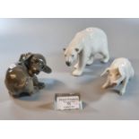 Three Royal Copenhagen porcelain animal figurines to include: 1407 puppy, 1700 seated pig and