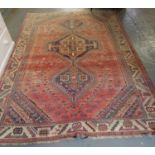 Middle Eastern design ping ground carpet with three central lozenge geometric medallions and