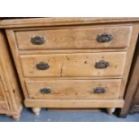 Late Victorian pine straight front chest of three drawers standing on baluster turned feet.