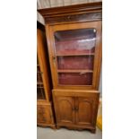 Late Victorian Welsh oak single door glazed kitchen/display cabinet with shaped apron and bracket