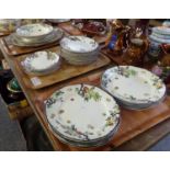 Four trays of Royal Doulton 'Woburn' design dinnerware to include: various plates, serving plates,