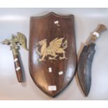 Theatrical Welsh dragon shield and brass headed axe, together with a Nepalese type Kukri with