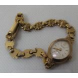 9ct gold Majex boat shaped small head ladies wrist watch with 9ct gold bracelet. Overall weight 8g